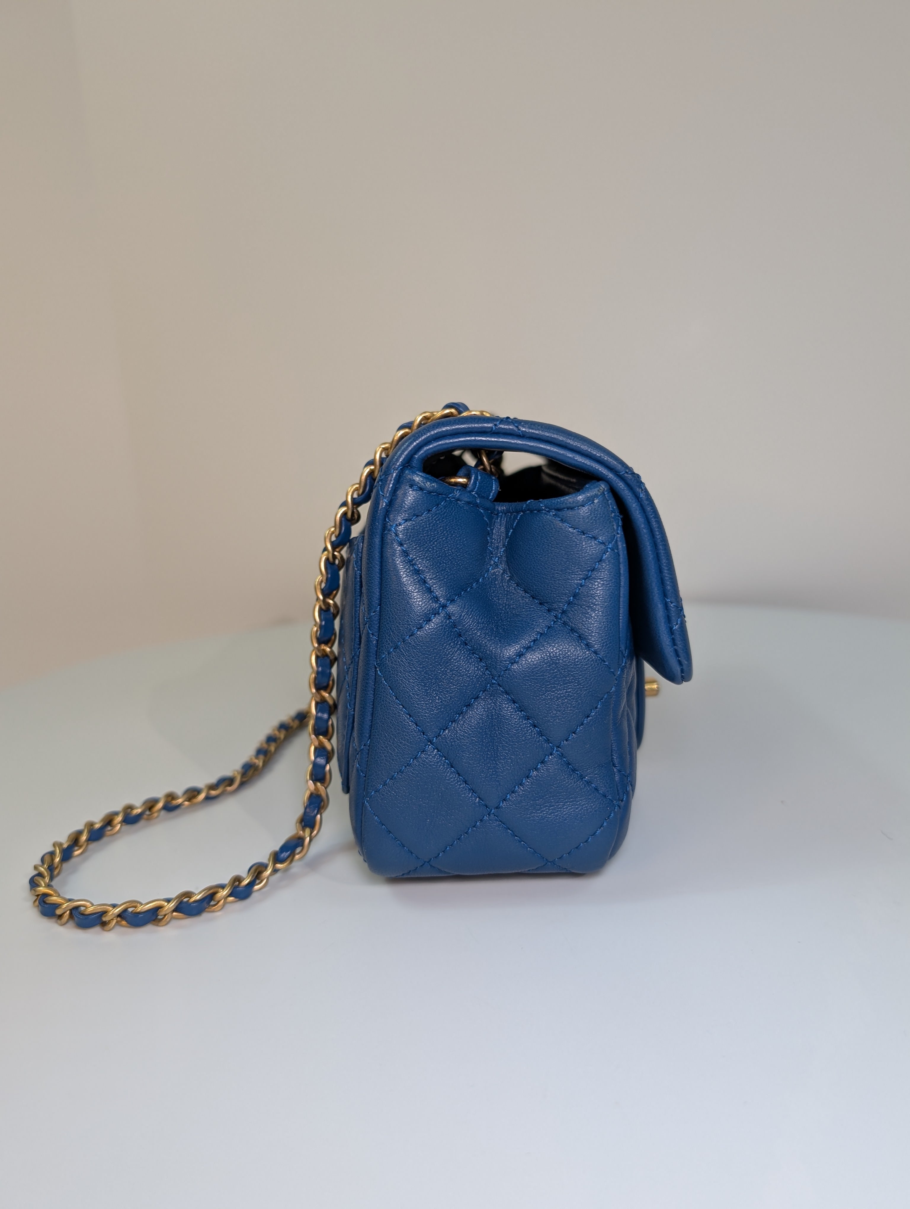 Chanel Blue Quilted Lambskin Round Charm Mini Flap Bag