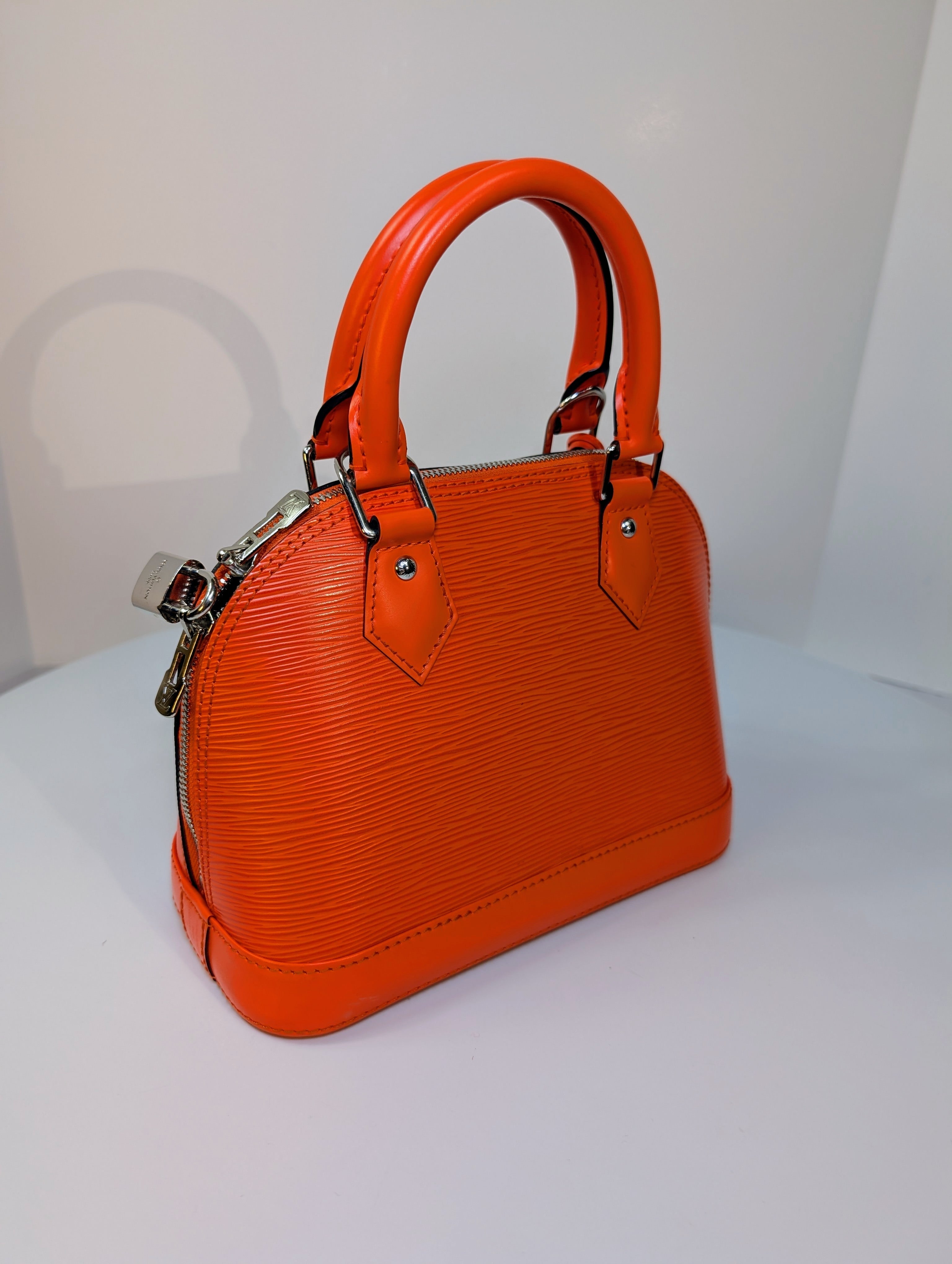 Louis Vuitton Mandarin Orange Epi Leather Alma BB with Jacquard Strap and Lock
