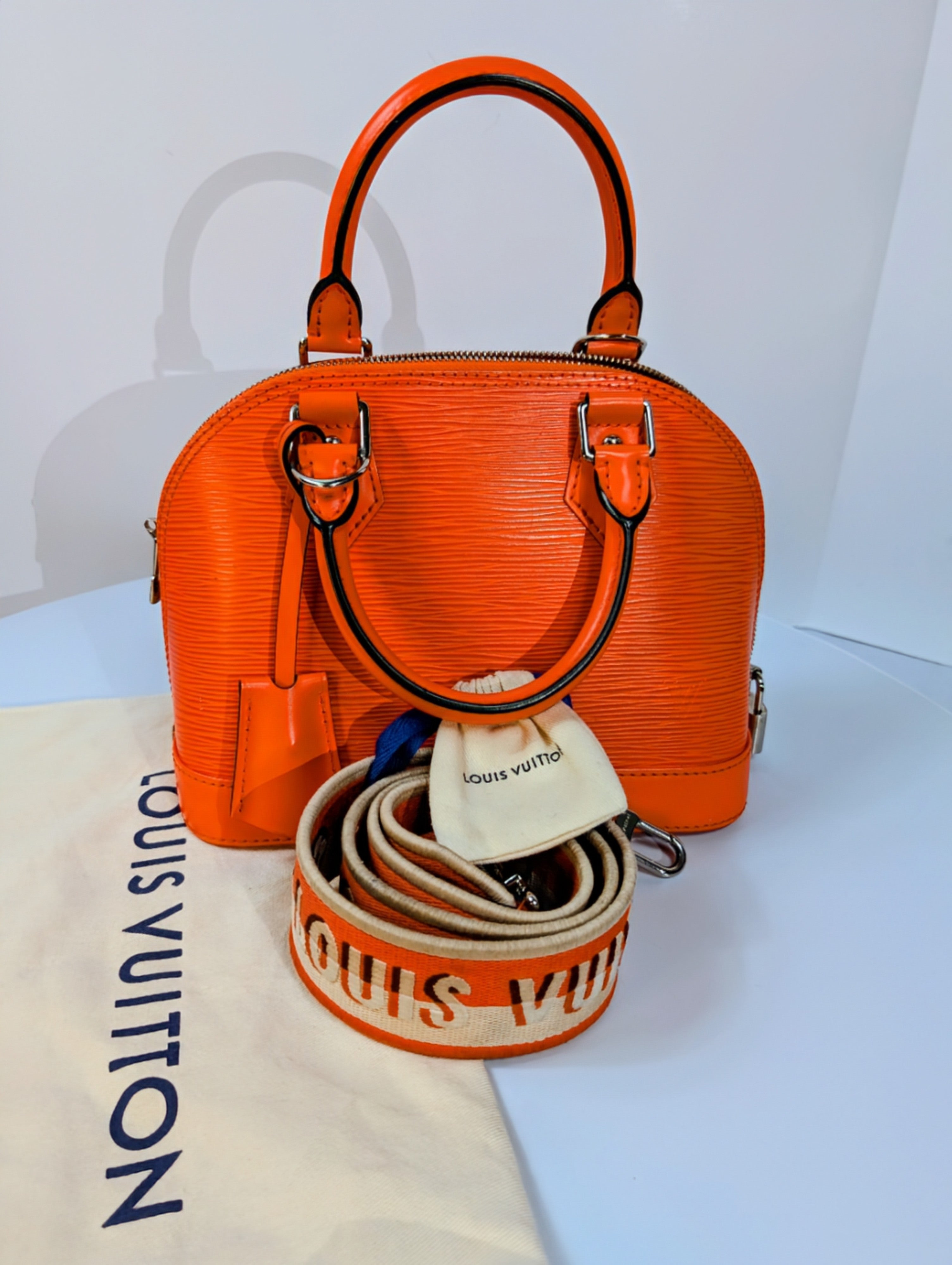 Louis Vuitton Mandarin Orange Epi Leather Alma BB with Jacquard Strap and Lock
