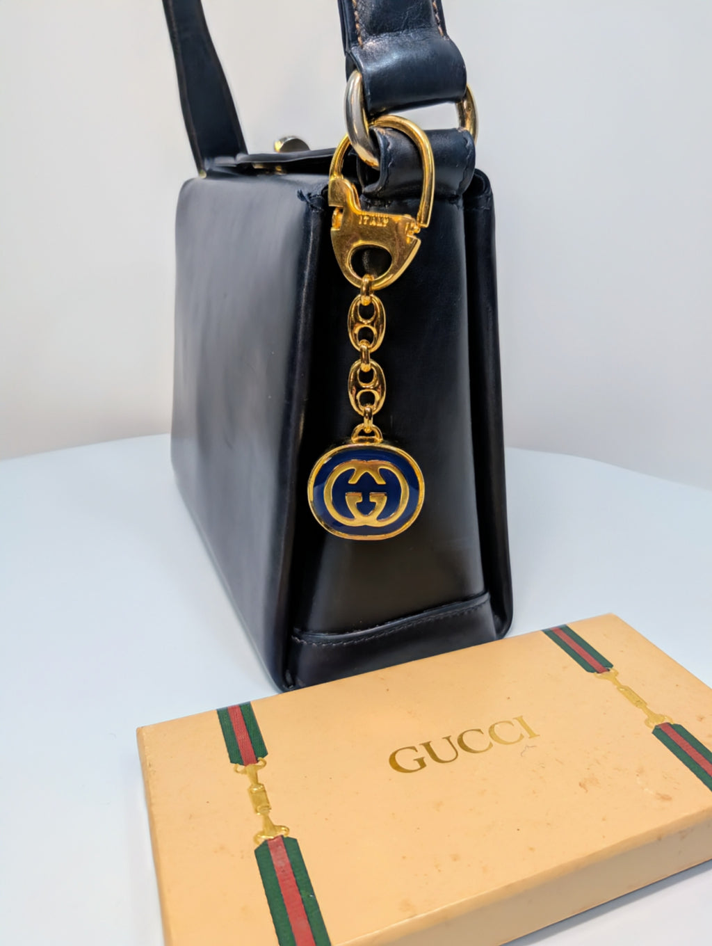 Gucci Vintage Gold Tone GG Logo Embossed Circle Bag Charm
