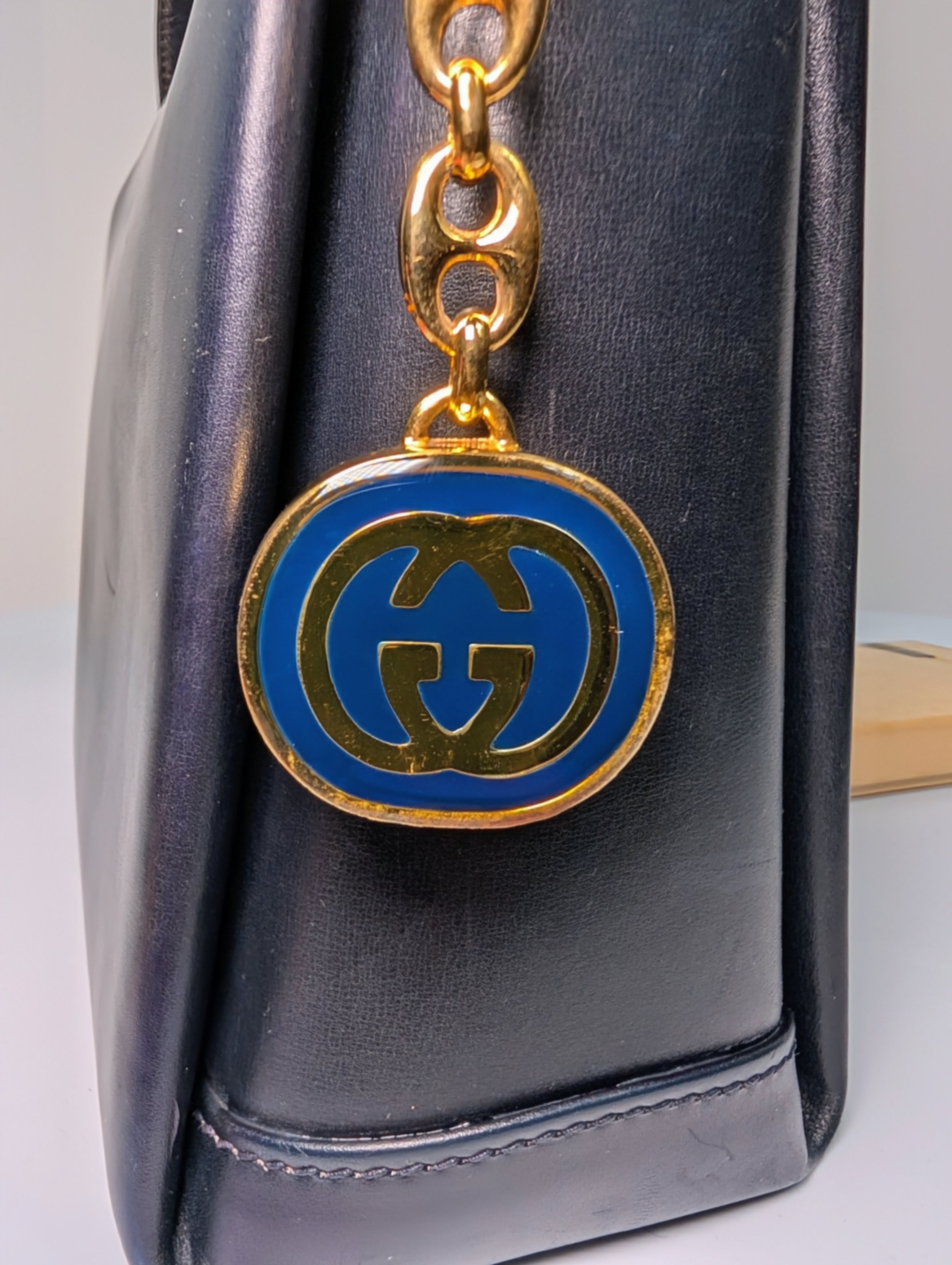 Gucci Vintage Gold Tone GG Logo Embossed Circle Bag Charm
