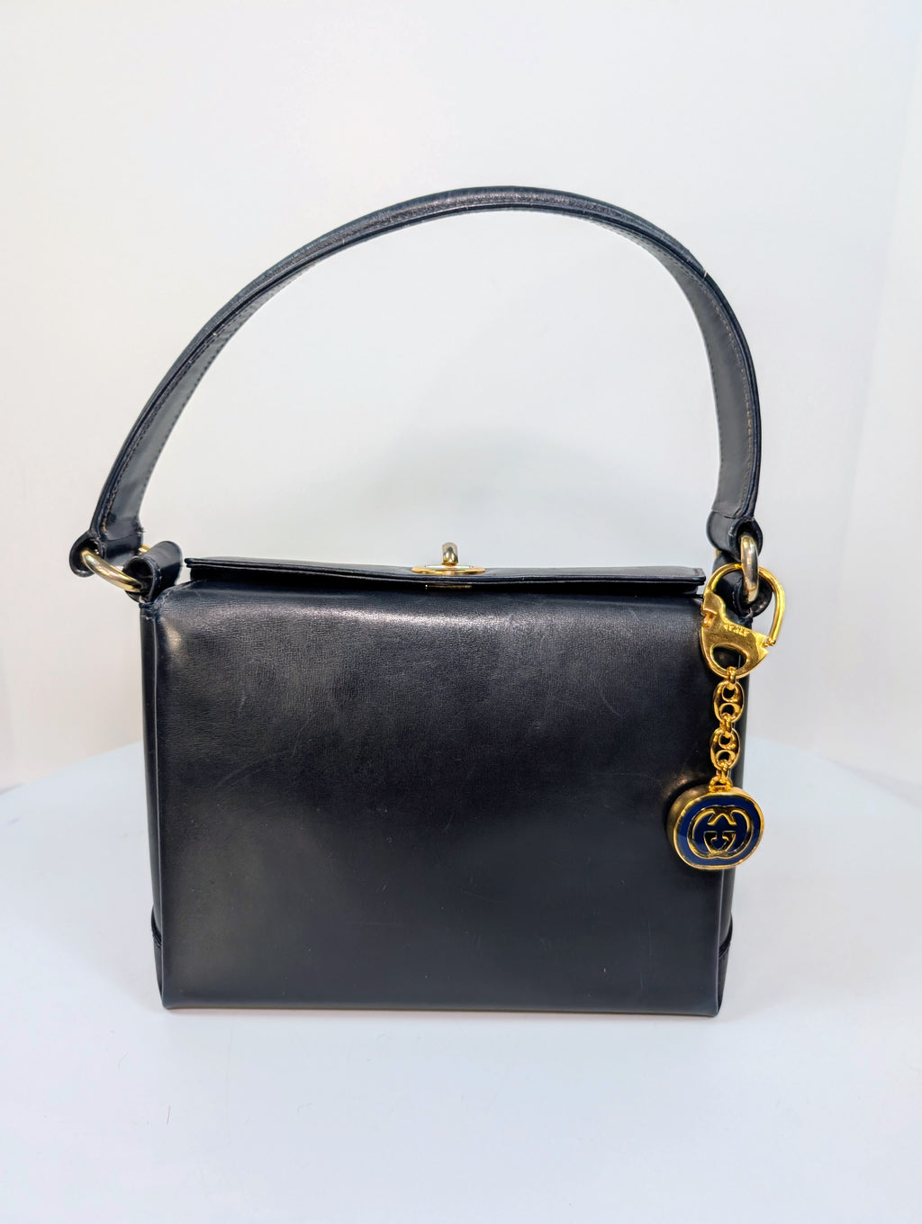 Gucci Vintage Gold Tone GG Logo Embossed Circle Bag Charm