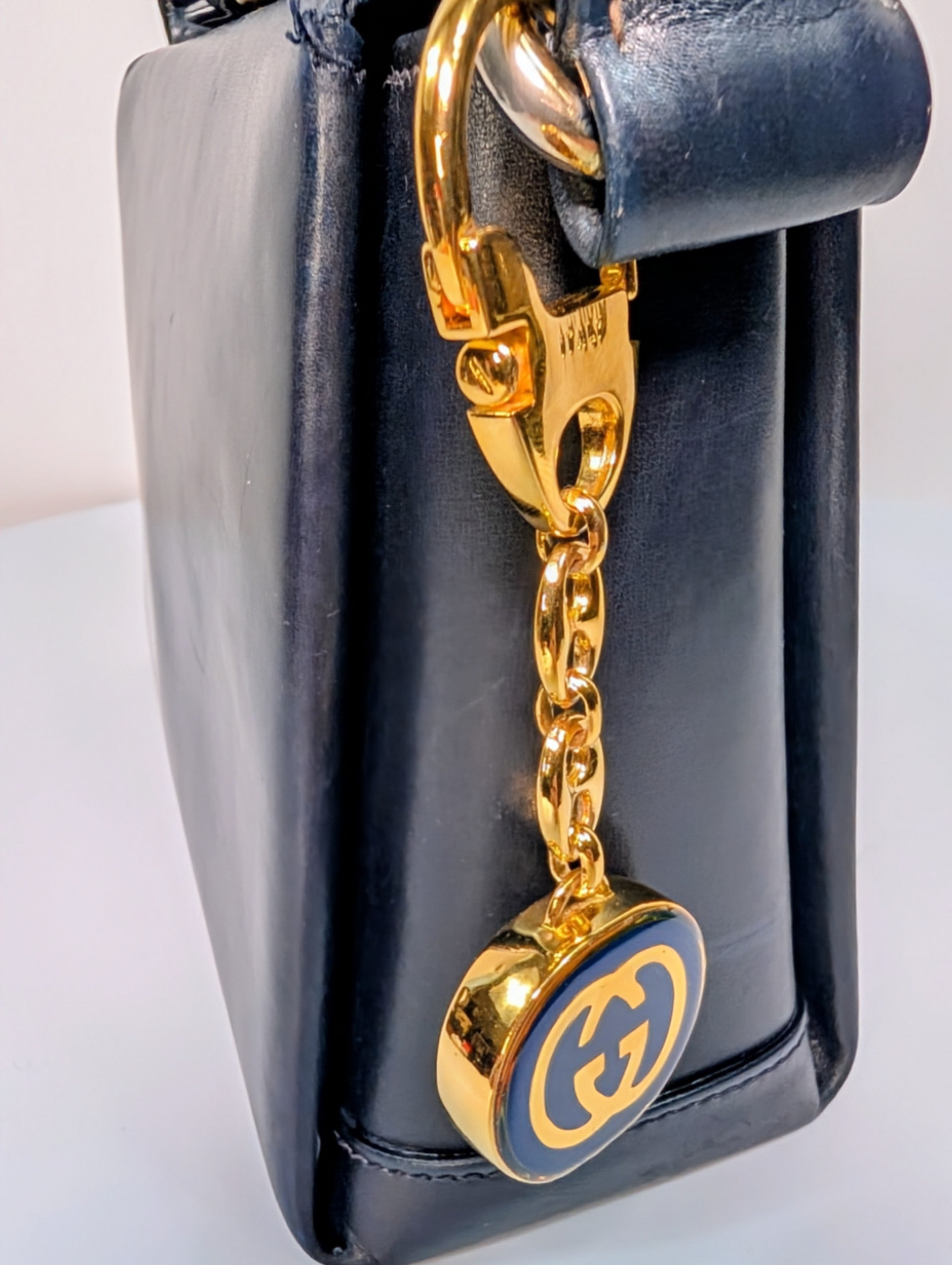 Gucci Vintage Gold Tone GG Logo Embossed Circle Bag Charm