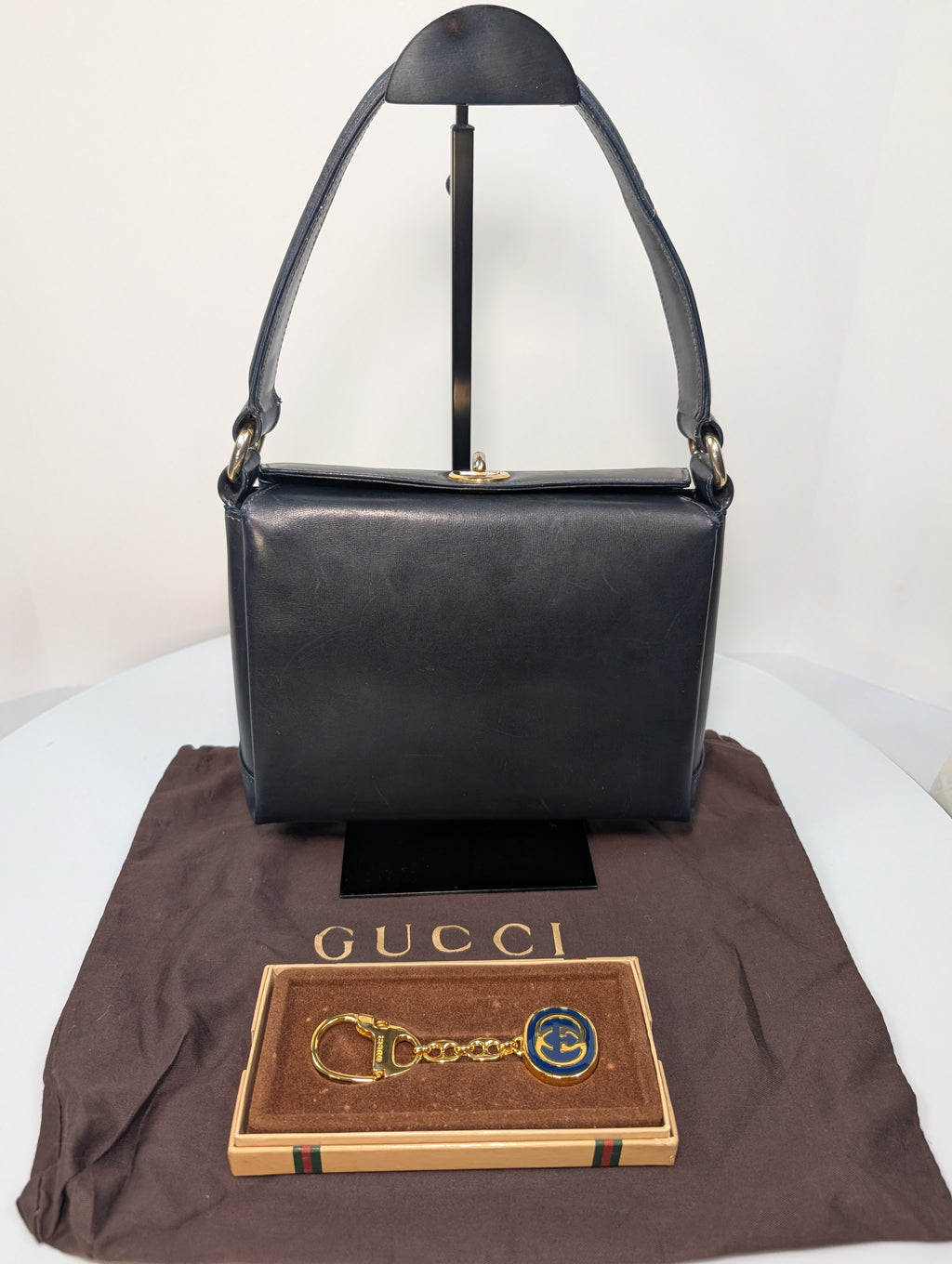 Gucci Vintage Gold Tone GG Logo Embossed Circle Bag Charm