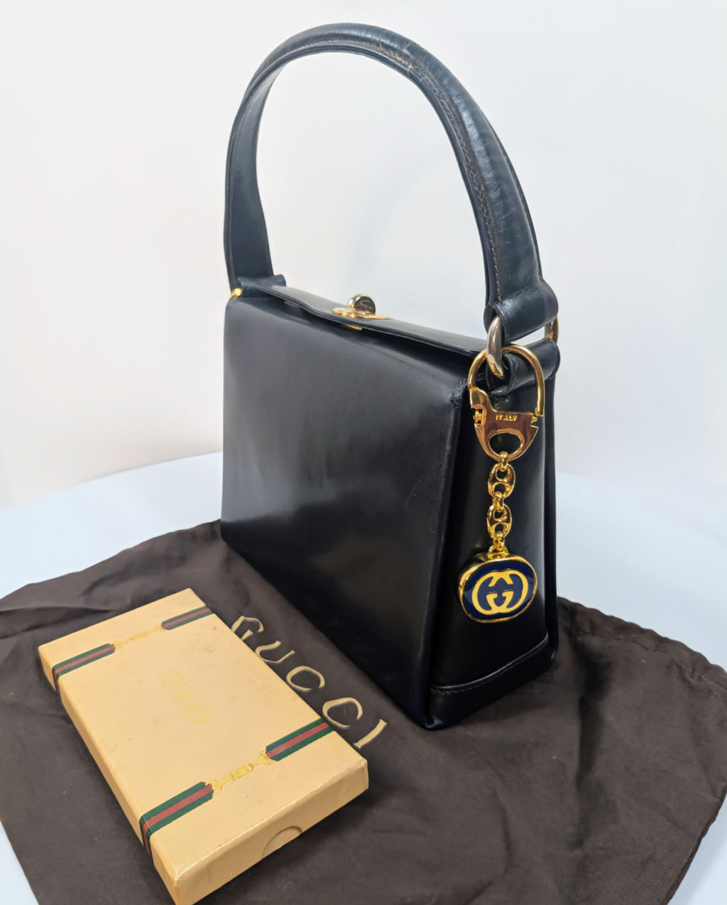 Gucci Vintage Gold Tone GG Logo Embossed Circle Bag Charm