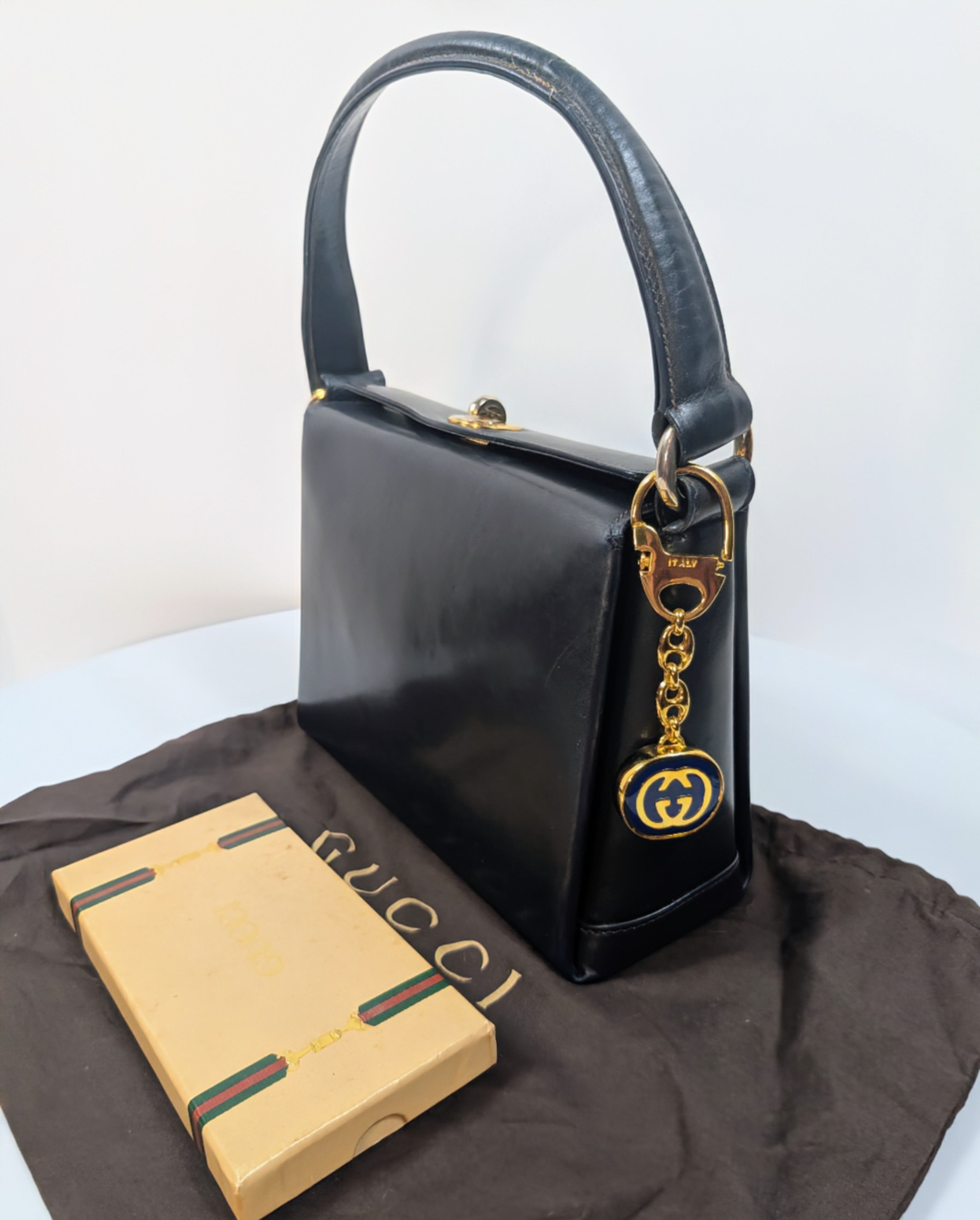 Gucci Vintage Gold Tone GG Logo Embossed Circle Bag Charm