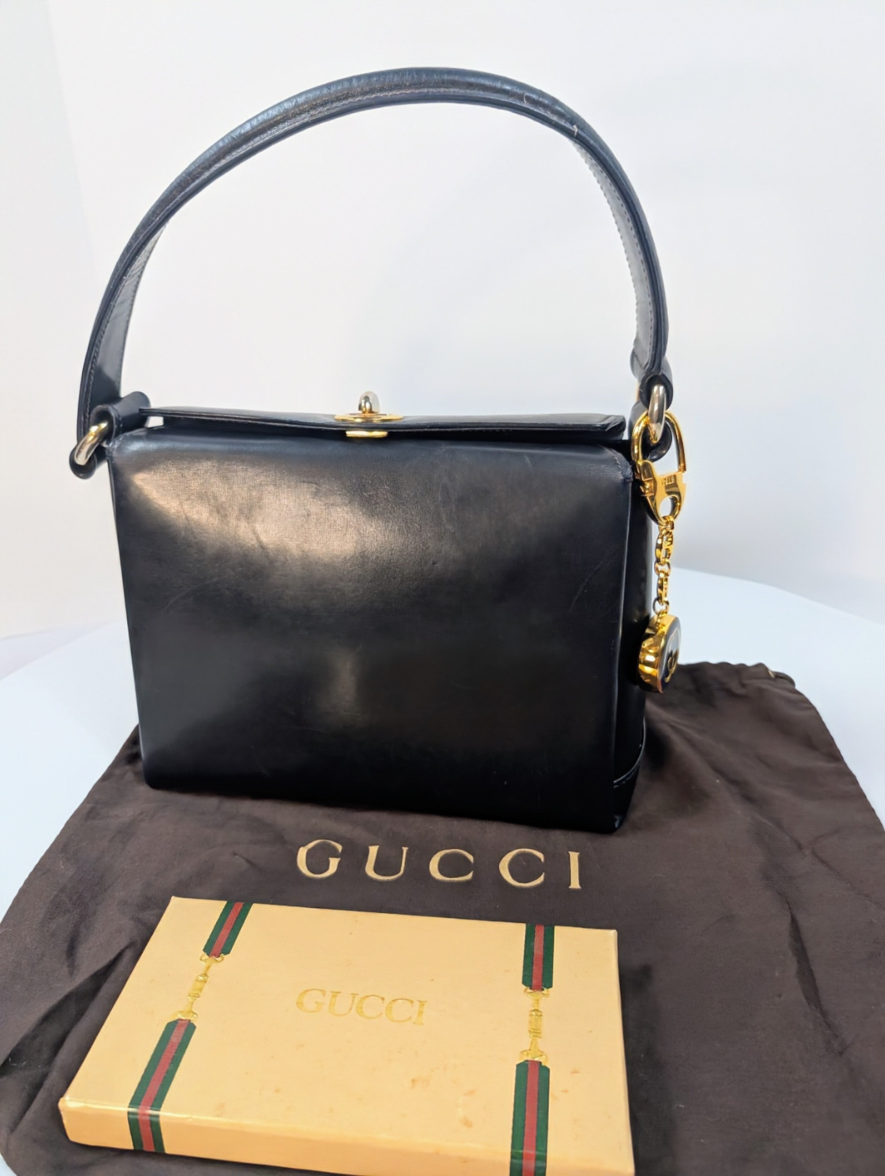 Gucci Vintage Gold Tone GG Logo Embossed Circle Bag Charm